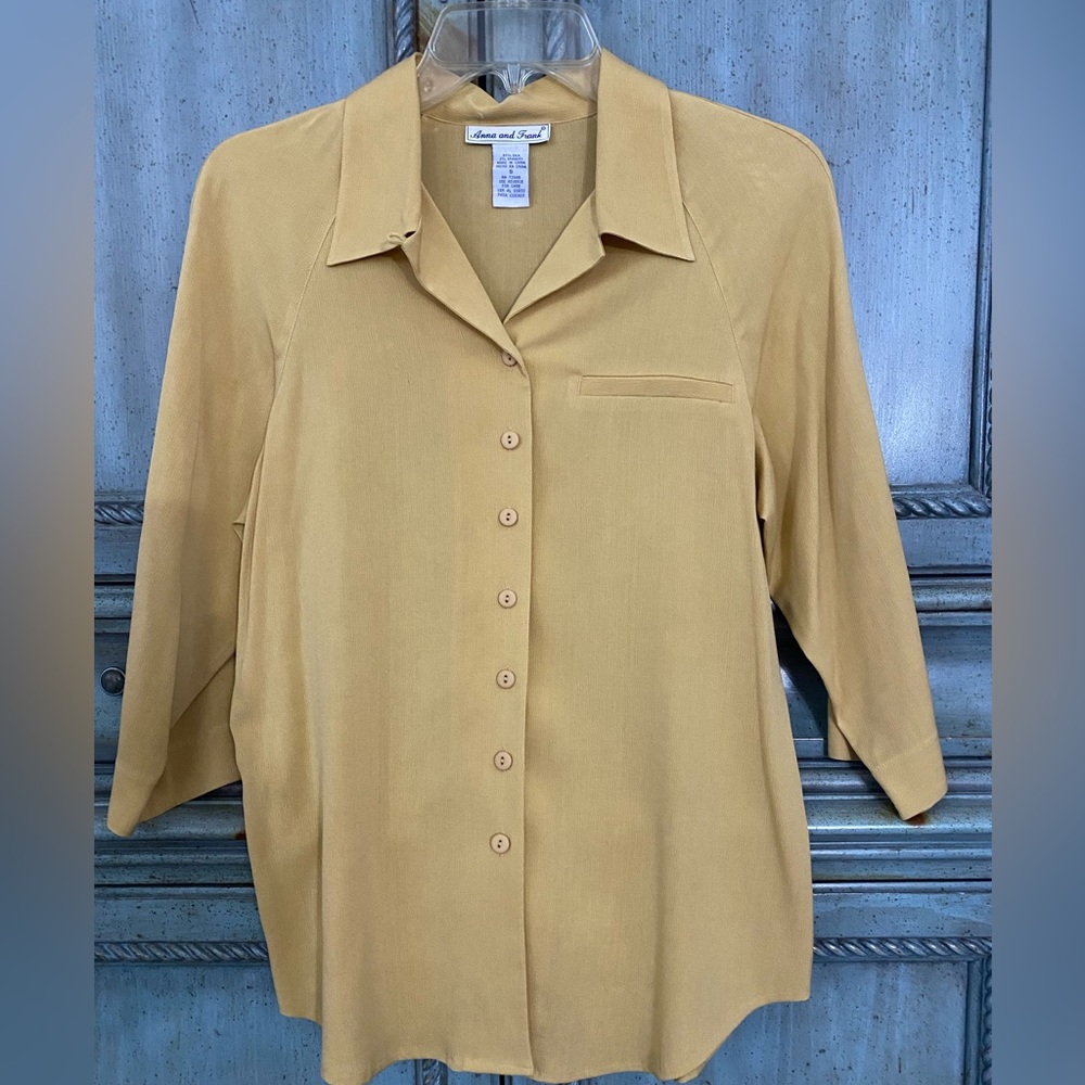 Gold silk blouse with notched collar and 3/4 sleeves